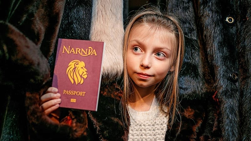 A young girl with her passport to Narnia
