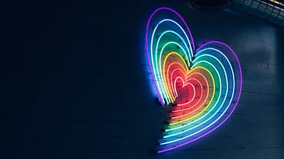 Neon heart signage in rainbow colours