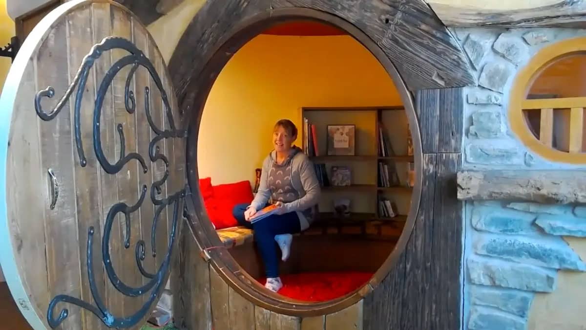 Storyteller sitting in the Hobbit house